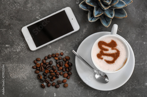 Cup of fresh aromatic coffee on table  top view