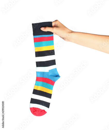 Woman holding colorful sock on white background