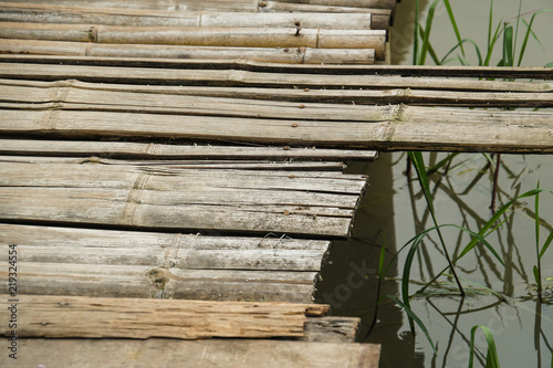 bamboo wood path bridge cross pass over rice field photo