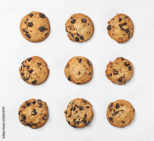 Flat lay composition with chocolate cookies on white background