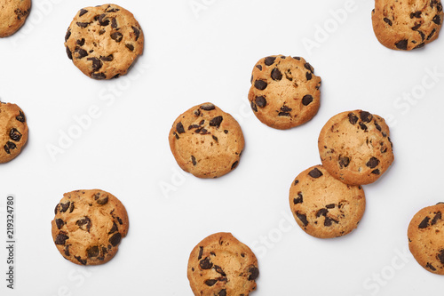 Flat lay composition with chocolate cookies on white background