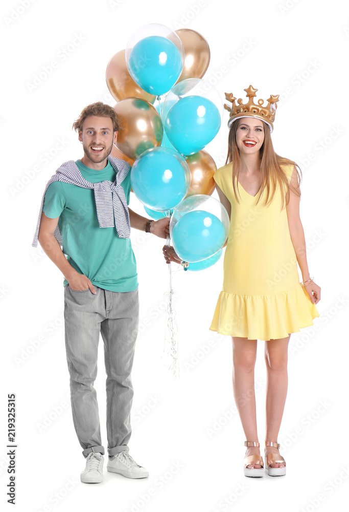 Young couple with air balloons on white background Young couple with air balloons on white background