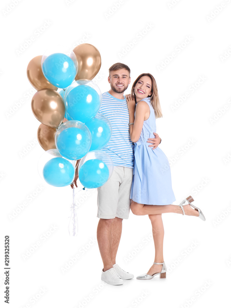 Young couple with air balloons on white background Young couple with air balloons on white background