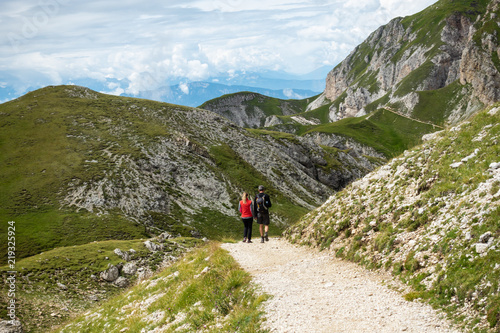 Hikers on a trail near mountain Sciliar