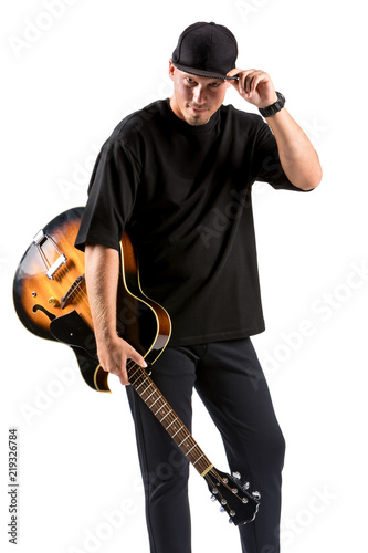 Young musician with acoustic guitar, isolated on white