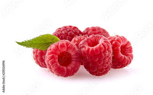 Raspberries with  leaf on white background