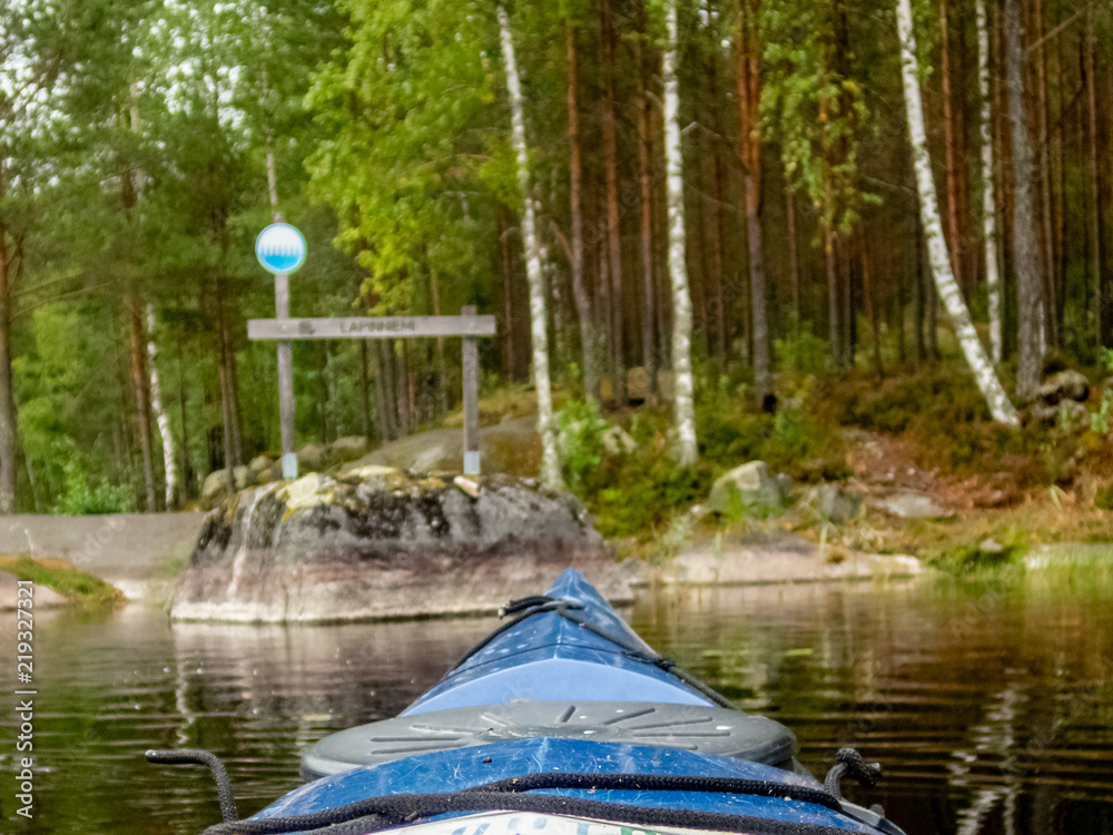 Obraz premium Kayaking on the calm Saimaa lake in Finland - 10