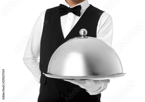 Waiter holding metal tray with lid on white background, closeup