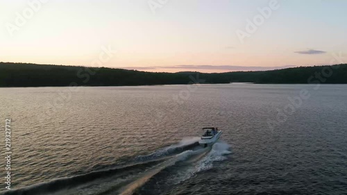 Wallpaper Mural Aerial footage of boat on lake at sunset Torontodigital.ca