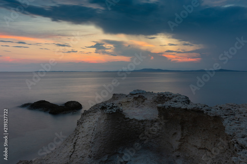 Sunset colors reflecting on the sea at Fanari beach, Komotini, Greece