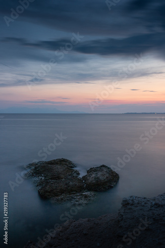Sunset colors reflecting on the sea at Fanari beach, Komotini, Greece