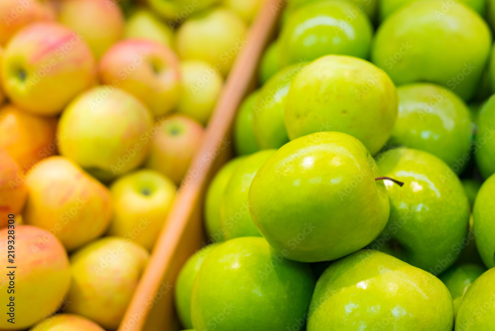 Bunch of green and yellow apples in supermarket Bunch of green and yellow apples in supermarket