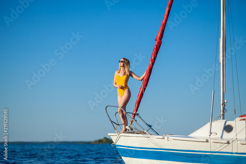 Girl resting on a yacht, a sailboat