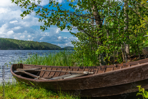 Old wooden rowing boat on the shore of the Saimaa lake in Finland - 11