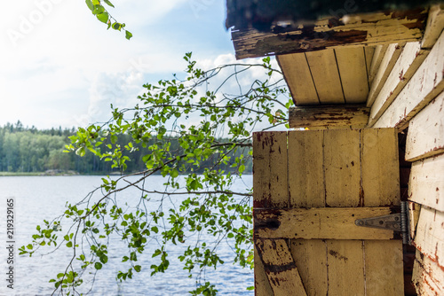 Deatil of an old wooden changing cabin on the shore of the Saimaa lake in Finland - 5 photo