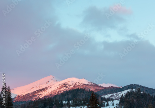 Pink sunrise morning winter mountain view photo