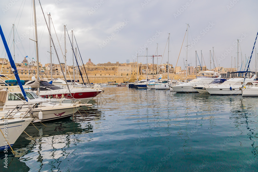Birgu, Malta. Yachts in the background of the fortress and the city
