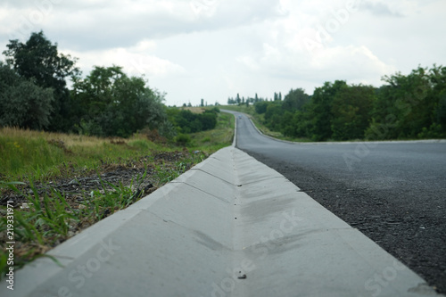 New roadbed and stormwater drainage. Stormwater drainage for drainage of rain water along the roadway.
