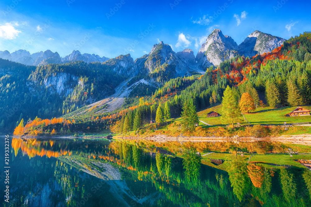 Beautiful view of idyllic colorful autumn scenery in Gosausee lake Austria - obrazy, fototapety, plakaty 
