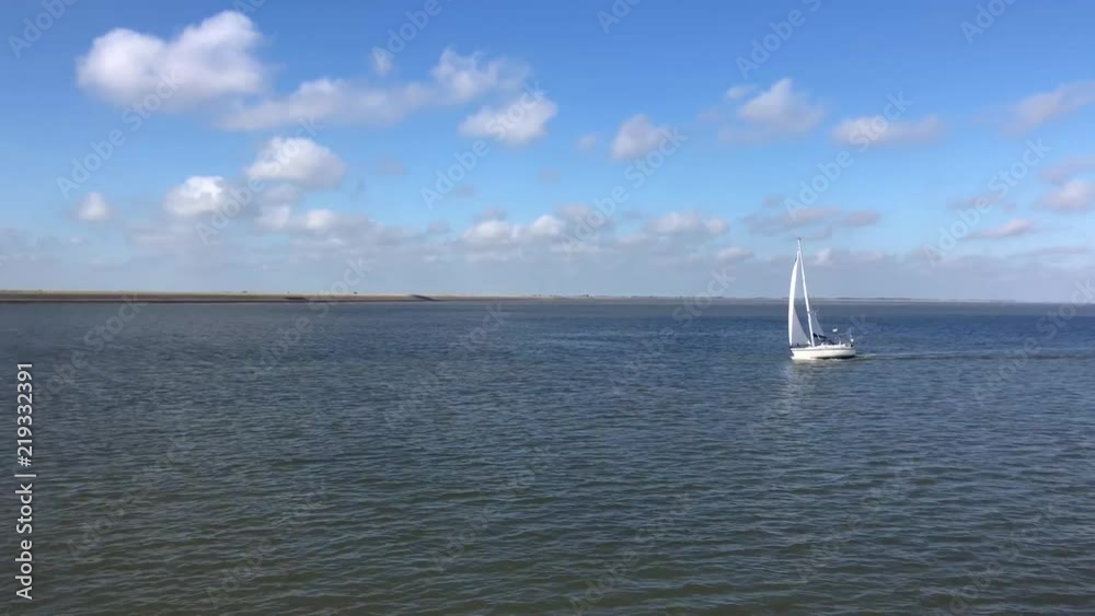 Sailing at the Wadden Sea in Friesland, The Netherlands Sailing at the Wadden Sea in Friesland, The Netherlands