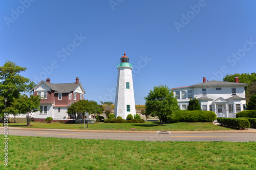 Old Point Comfort Lighthouse and keeper`s quarters in Fort Monroe, Chesapeake Bay, Virginia, USA.
