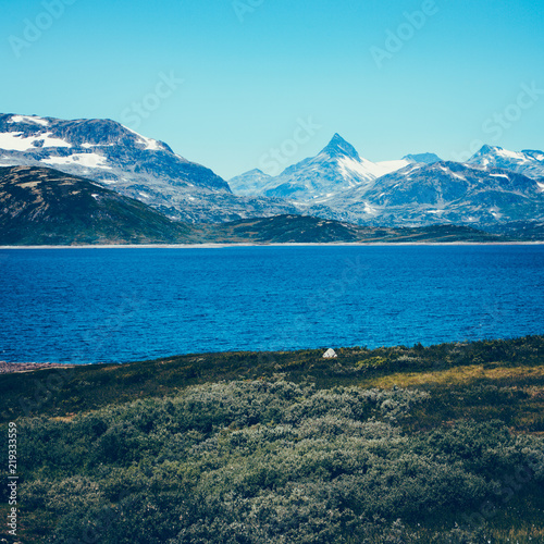 Fototapeta Naklejka Na Ścianę i Meble -  Panorama of Norwegian north countryside with Jotunheimen National Park mountains tops in the background