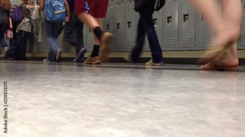 Students changing classes with a school locker background and copy space	