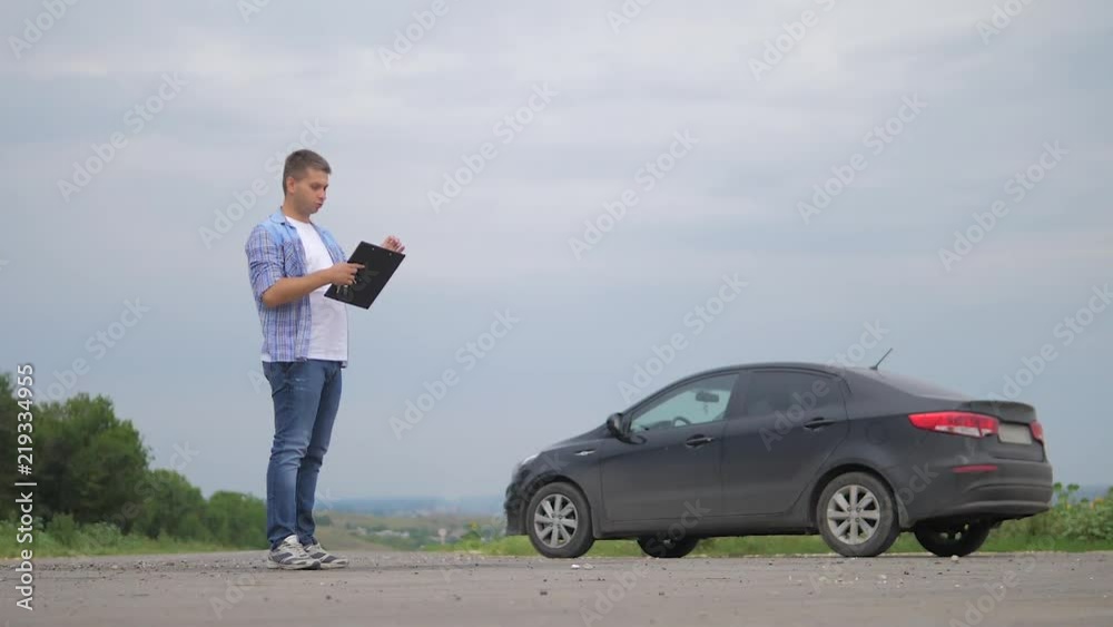 On the road car accident insurance agent examining carcrash owner and insurance staff make paper form. two men make a deal. man seller driver makes car the auto insurance slow motion video sale sells On the road car accident insurance agent examining carcrash owner and insurance staff make paper form. two men make a deal. man seller driver makes car the auto insurance slow motion video sale sells