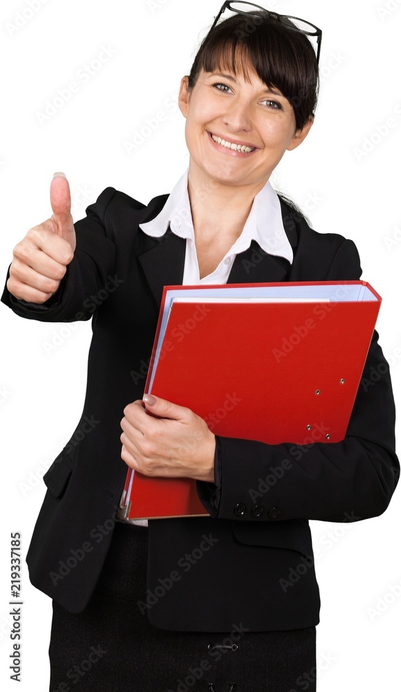 Woman in business suit with binder giving thumbs up Woman in business suit with binder giving thumbs up