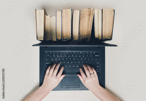 Creative concept of book and laptop