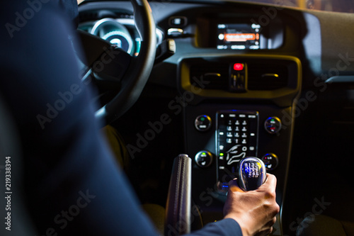 Driving a car at night - pretty, young woman driving her modern car at night, in a city (shallow DOF  color toned image) © lightpoet