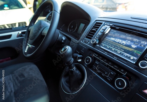 Closeup of a Car Audio System and Steering Wheel in a Modern Car © BillionPhotos.com