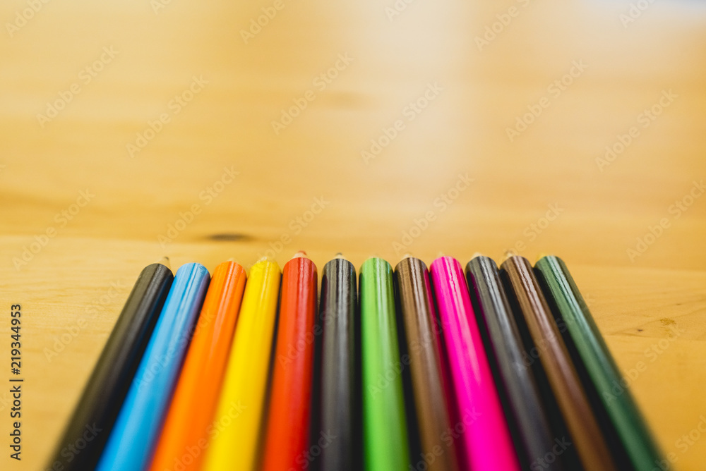 Fototapeta premium Colored pencils ordered to paint at school.