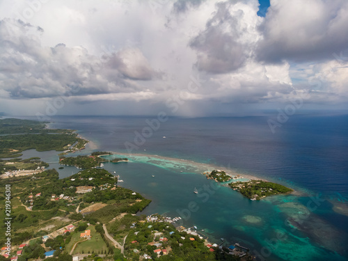 Aerial Of Tropical Rain Over Caribbean Sea With Island Foreground © Doug Miles 