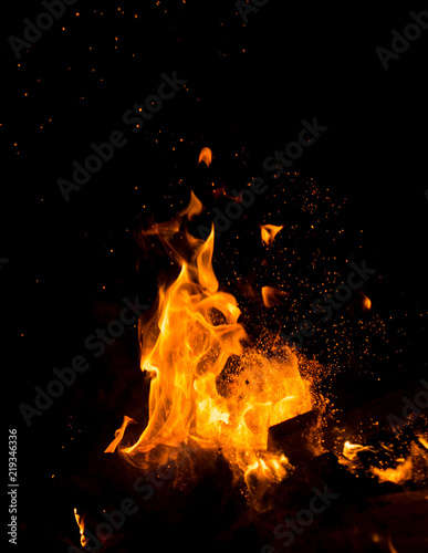 Flame of fire with sparks on a black background