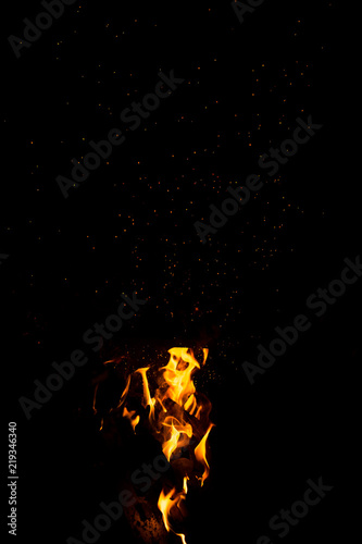 Flame of fire with sparks on a black background