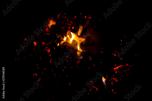 Flame of fire with sparks on a black background