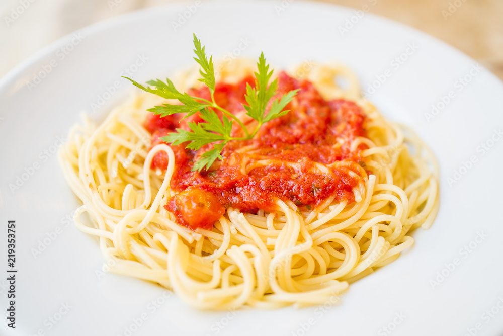 Delicious spaghetti pasta with tomato sauce and parsley, homemade healthy italian pasta on marble background, taste spaghetti Delicious spaghetti pasta with tomato sauce and parsley, homemade healthy italian pasta on marble background, taste spaghetti