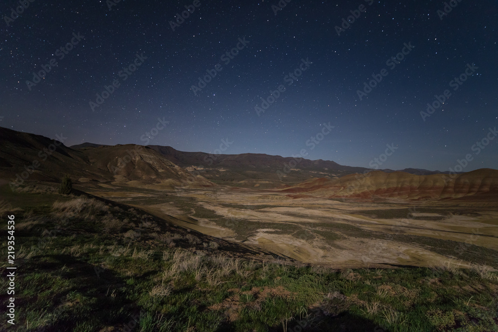 Starry night sky over Painted Hills in Oregon, USA