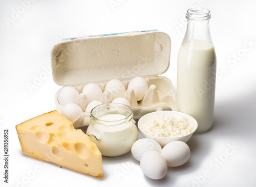 Dairy Products- Cheeses, Eggs and Milk on the Grey Background