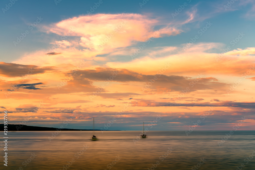 Beautiful sunset and cloudy sky over horizon of Lake Superior