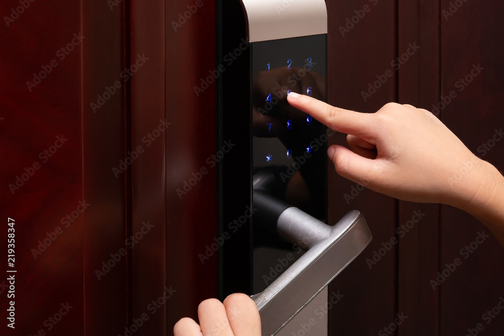 kid inputing passwords on an electronic door lock Stock Photo Adobe Stock