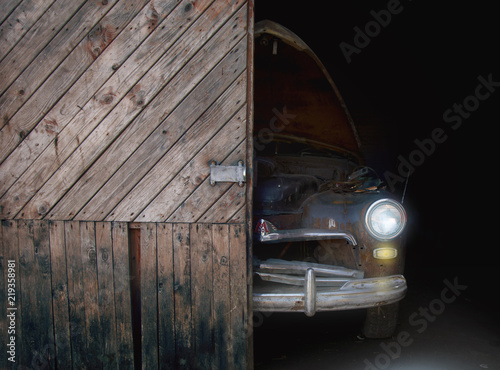 Old rusty retro  car behind open garage door .Classic car background.Classic old rusty retro cars, great design for any purposes