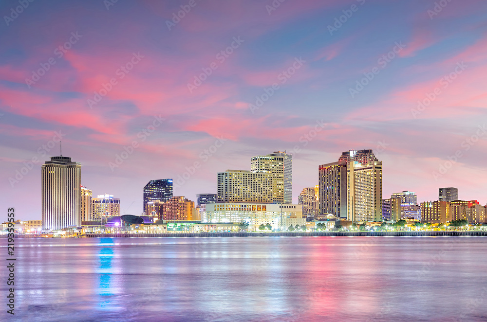 Downtown New Orleans, Louisiana and the Mississippi River at twilight