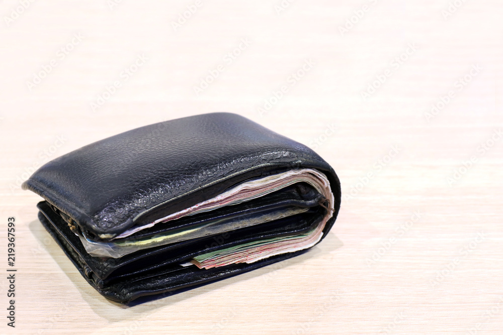 wallet, billfold, black leather wallet wooden board background and copy space, wallet full of banknotes and credit cards wallet, billfold, black leather wallet wooden board background and copy space, wallet full of banknotes and credit cards