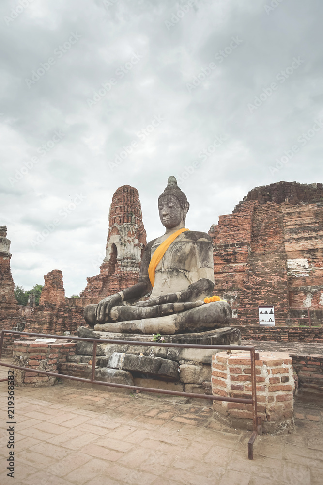 Buddha statue in Wat Mahathat, Ayutthaya, Thailand. Buddha statue in Wat Mahathat, Ayutthaya, Thailand.
