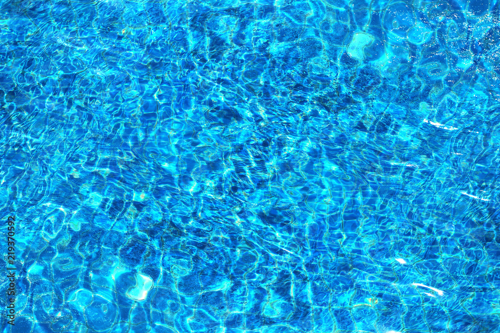 Photo background of bright bubbling blue water