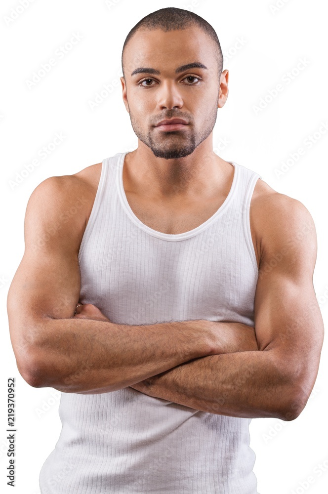 Handsome and Muscular Man Standing with Arm Folded - Isolated Handsome and Muscular Man Standing with Arm Folded - Isolated