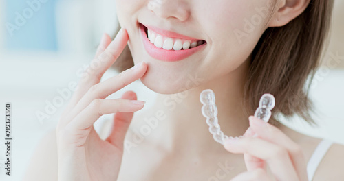 woman take invisible braces