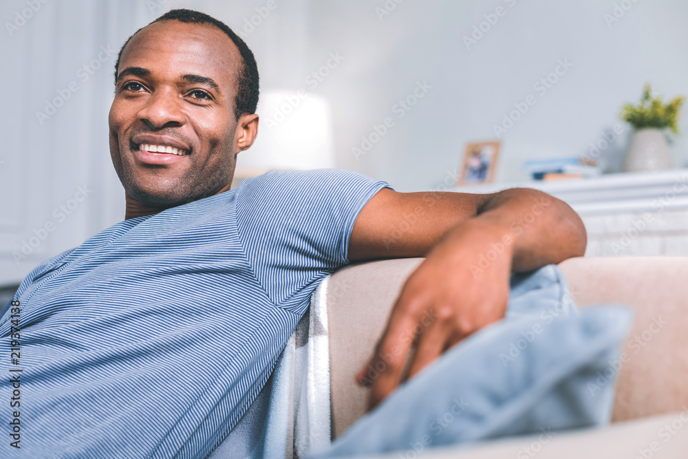 Obraz premium Day off. High-spirited man thinking while relaxing